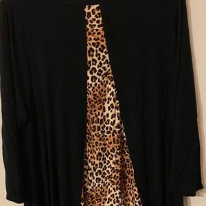 Beautiful thin dressy top. The front is solid black. Only worn once!!